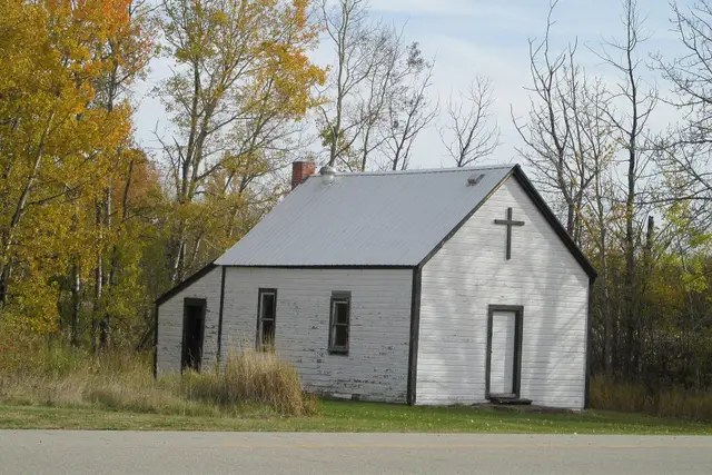 Small white church in autumn
